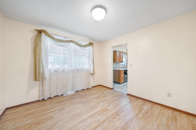 299 Sherwood Downs S, Newark, OH 43055 - spare room featuring light wood-style floors and baseboards