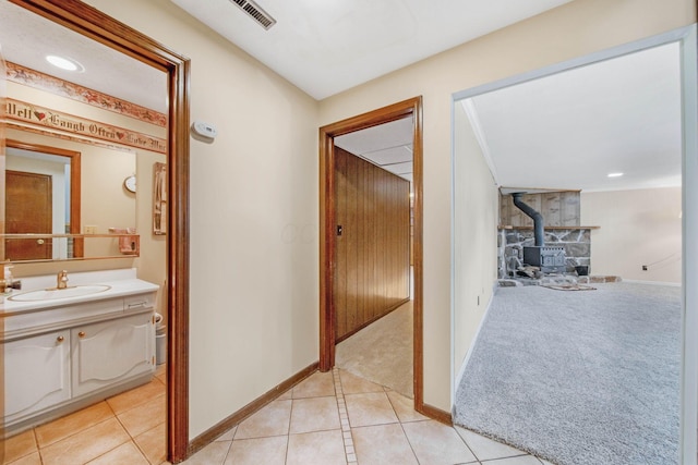 299 Sherwood Downs S, Newark, OH 43055 - hallway featuring a sink, light tile patterned floors, and baseboards