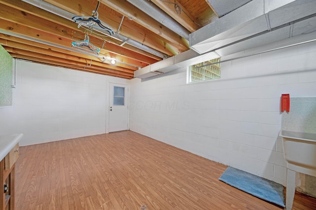 299 Sherwood Downs S, Newark, OH 43055 - basement featuring wood finished floors and concrete block wall