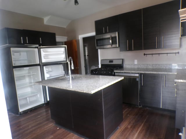 905-907 Beech St, Columbus, OH 43206 - kitchen featuring appliances with stainless steel finishes, dark cabinetry, dark wood-style floors, a sink, and modern cabinets