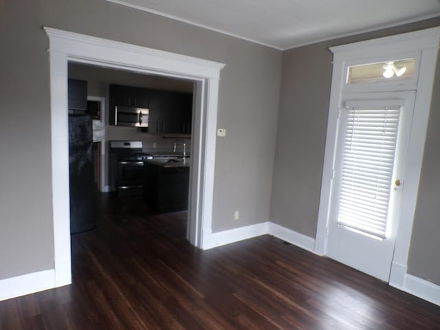 905-907 Beech St, Columbus, OH 43206 - unfurnished dining area featuring dark wood-type flooring, baseboards, and ornamental molding