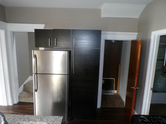 905-907 Beech St, Columbus, OH 43206 - kitchen with freestanding refrigerator, dark wood-type flooring, and light stone counters