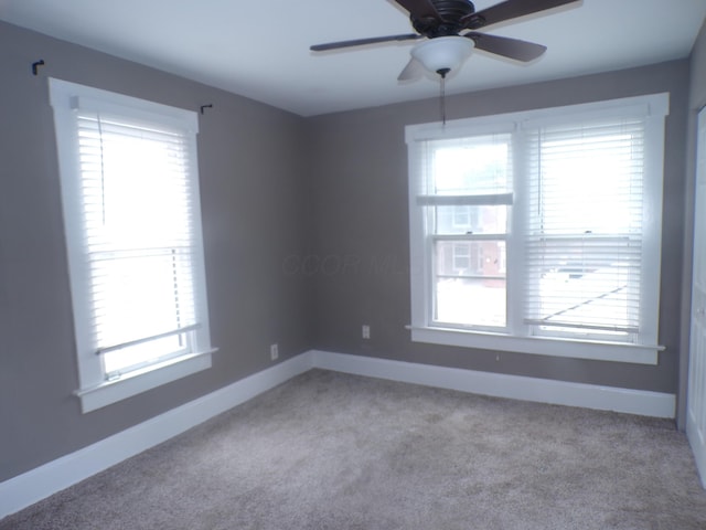 905-907 Beech St, Columbus, OH 43206 - carpeted empty room with baseboards and healthy amount of natural light