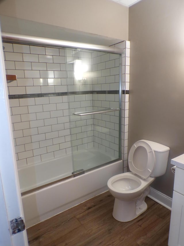905-907 Beech St, Columbus, OH 43206 - bathroom with toilet, combined bath / shower with glass door, vanity, and wood finished floors