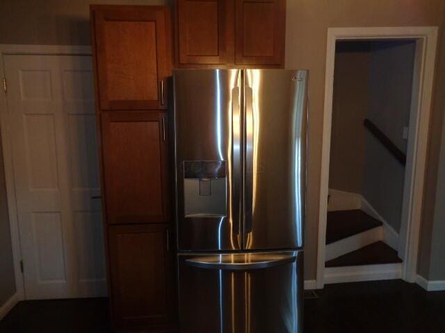905-907 Beech St, Columbus, OH 43206 - kitchen featuring stainless steel fridge, brown cabinetry, and baseboards