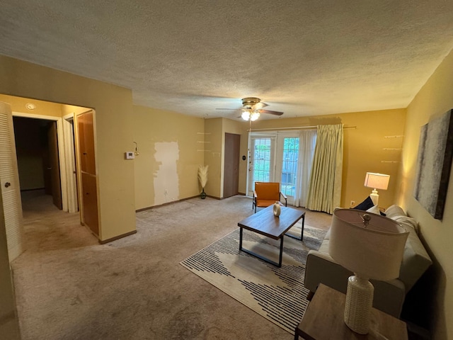2348 Woodbrook Cir N Unit 86, Columbus, OH 43223 - living room with light colored carpet, a ceiling fan, a textured ceiling, and baseboards