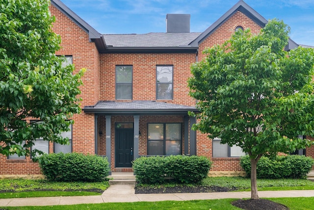 797 S Front St, Columbus, OH 43206 - view of front of home with brick siding and a chimney