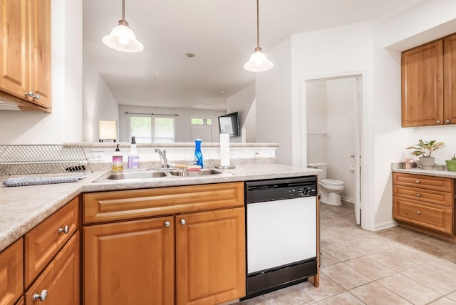 797 S Front St, Columbus, OH 43206 - kitchen featuring white dishwasher, a sink, light countertops, and light tile patterned floors