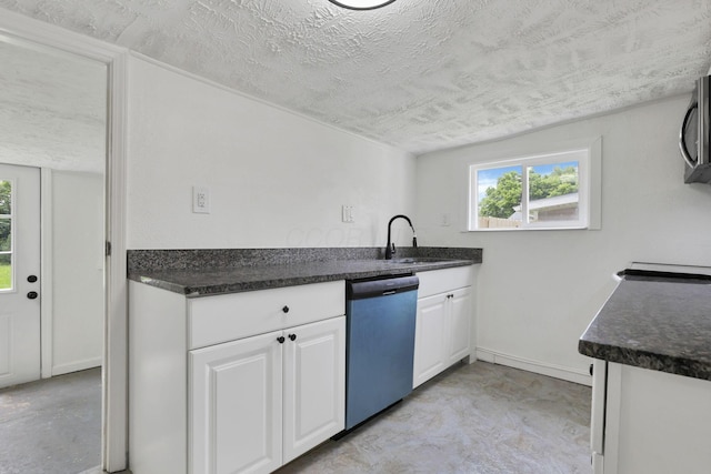 663 E Mound St, Circleville, OH 43113 - kitchen with dishwasher, white cabinets, a textured ceiling, and a sink