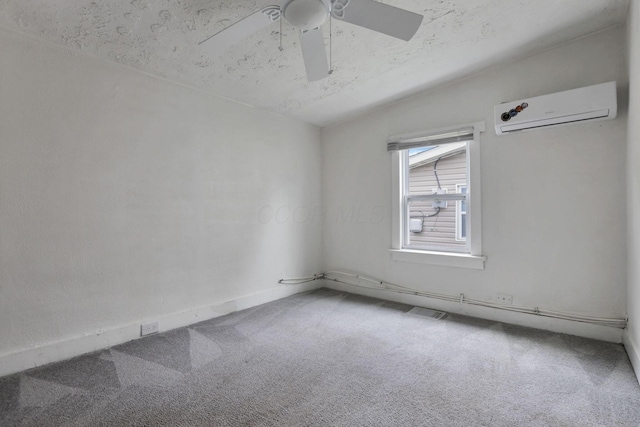 663 E Mound St, Circleville, OH 43113 - carpeted spare room with a wall unit AC, a ceiling fan, and baseboards