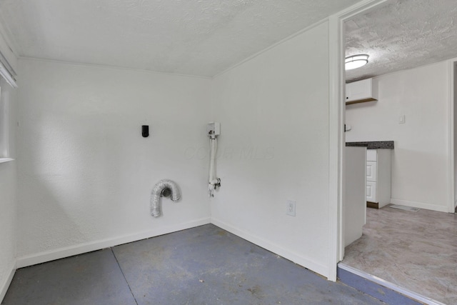 663 E Mound St, Circleville, OH 43113 - laundry room featuring baseboards and a textured ceiling