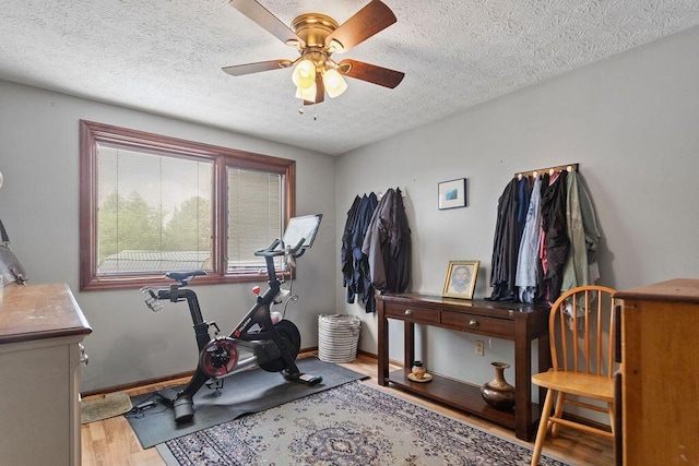 6799 Thrasher Ct, Orient, OH 43146 - workout area featuring wood finished floors, ceiling fan, a textured ceiling, and baseboards