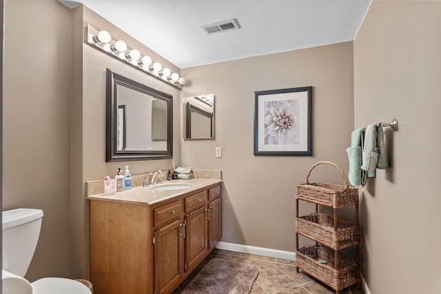 6799 Thrasher Ct, Orient, OH 43146 - bathroom featuring vanity, toilet, baseboards, and tile patterned flooring