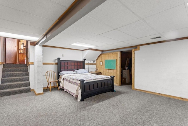 6799 Thrasher Ct, Orient, OH 43146 - bedroom featuring carpet, baseboards, a drop ceiling, and wood walls
