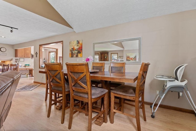 6799 Thrasher Ct, Orient, OH 43146 - dining area featuring a textured ceiling, light wood-style floors, and baseboards