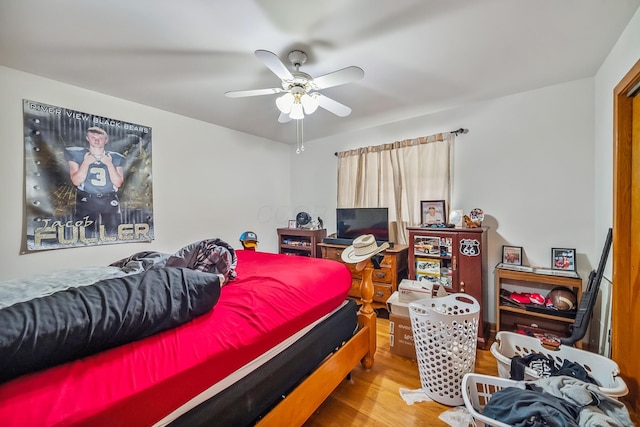 320 N 3rd St, Coshocton, OH 43812 - bedroom with wood finished floors and a ceiling fan