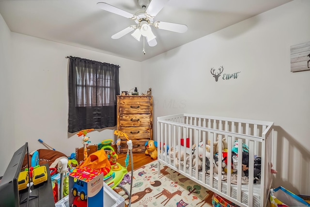 320 N 3rd St, Coshocton, OH 43812 - bedroom with wood finished floors and ceiling fan