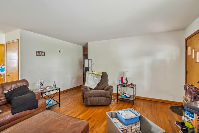 320 N 3rd St, Coshocton, OH 43812 - living area with wood finished floors and baseboards