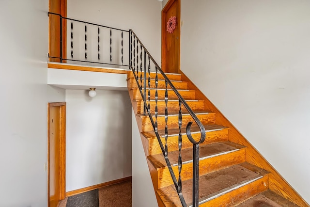 320 N 3rd St, Coshocton, OH 43812 - staircase featuring carpet and baseboards
