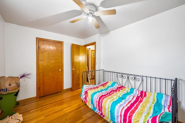 320 N 3rd St, Coshocton, OH 43812 - bedroom featuring wood finished floors, a ceiling fan, and baseboards