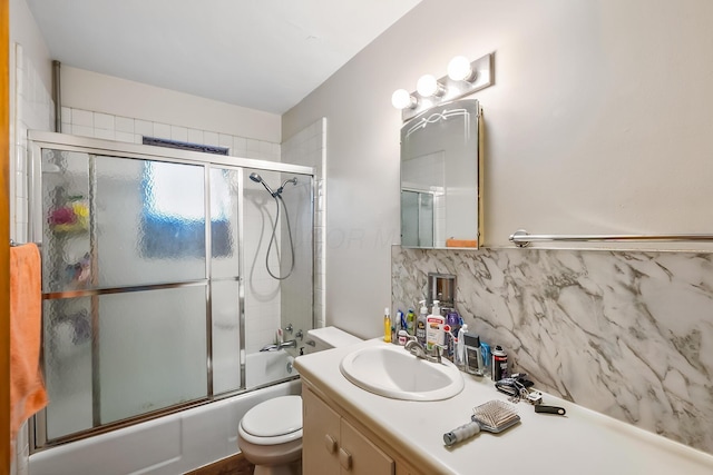 320 N 3rd St, Coshocton, OH 43812 - bathroom featuring decorative backsplash, vanity, toilet, and bath / shower combo with glass door