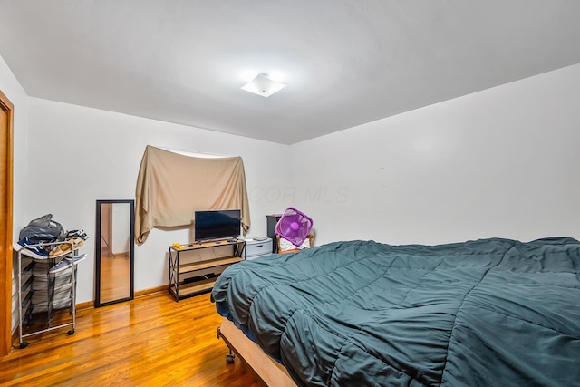 320 N 3rd St, Coshocton, OH 43812 - bedroom with light wood-style floors and baseboards