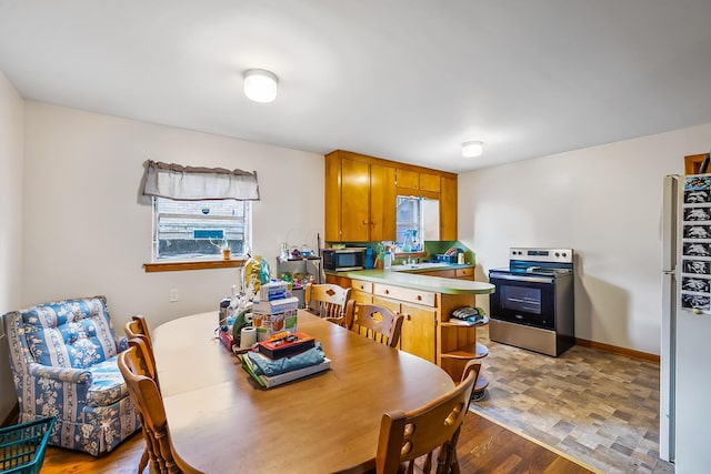 320 N 3rd St, Coshocton, OH 43812 - dining room with healthy amount of natural light and light wood finished floors