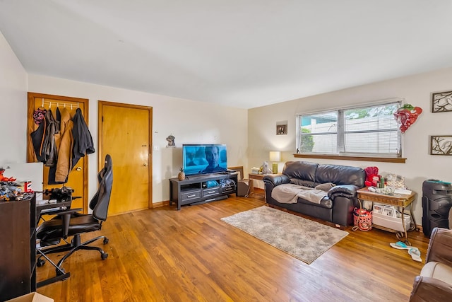 320 N 3rd St, Coshocton, OH 43812 - living room with wood finished floors and an office area
