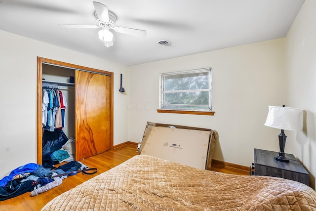 320 N 3rd St, Coshocton, OH 43812 - bedroom featuring wood finished floors, a closet, ceiling fan, and baseboards