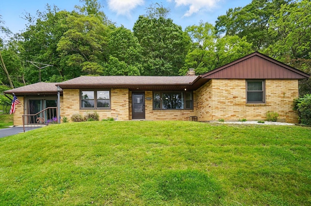 1244 N Broad St, Lancaster, OH 43130 - single story home featuring brick siding, a front yard, and a chimney