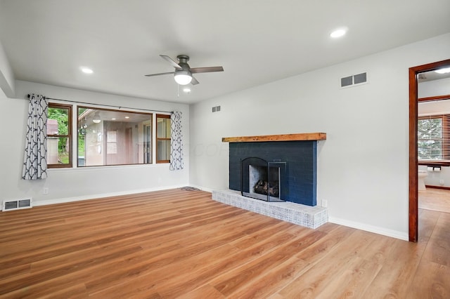 1244 N Broad St, Lancaster, OH 43130 - unfurnished living room featuring ceiling fan, wood finished floors, a brick fireplace, recessed lighting, and baseboards
