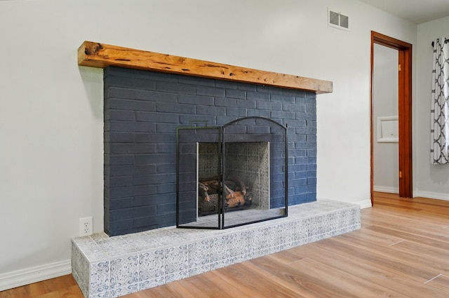 1244 N Broad St, Lancaster, OH 43130 - detailed view of a fireplace, wood finished floors, and baseboards