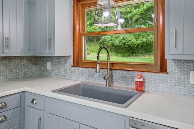 1244 N Broad St, Lancaster, OH 43130 - kitchen featuring a sink, gray cabinetry, decorative backsplash, and light countertops
