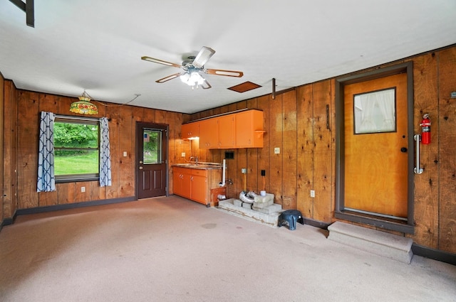 1244 N Broad St, Lancaster, OH 43130 - interior space with wooden walls, ceiling fan, baseboards, and a sink