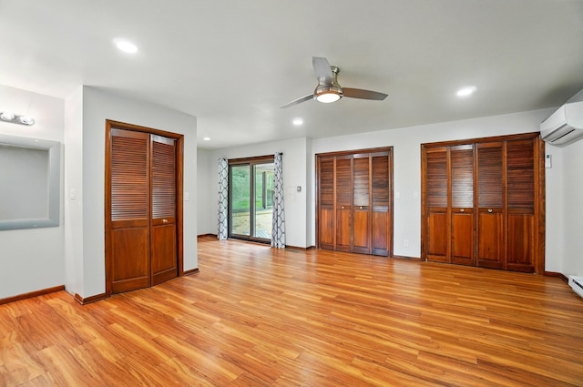1244 N Broad St, Lancaster, OH 43130 - unfurnished bedroom with light wood-type flooring, access to outside, a wall mounted air conditioner, recessed lighting, and baseboards