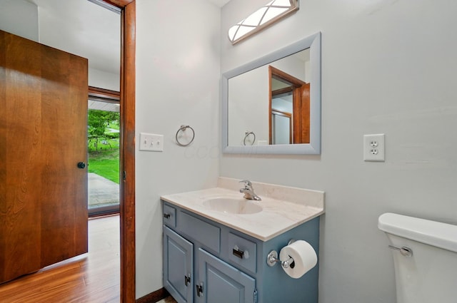 1244 N Broad St, Lancaster, OH 43130 - bathroom with toilet, vanity, and wood finished floors