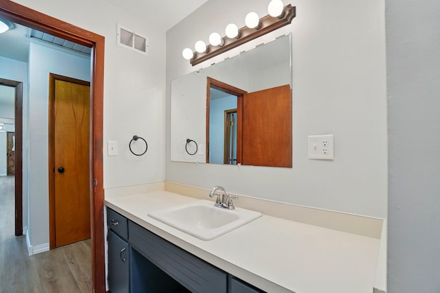 1244 N Broad St, Lancaster, OH 43130 - bathroom featuring wood finished floors and vanity