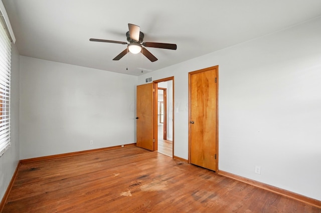 1244 N Broad St, Lancaster, OH 43130 - unfurnished bedroom featuring baseboards, wood finished floors, and multiple windows