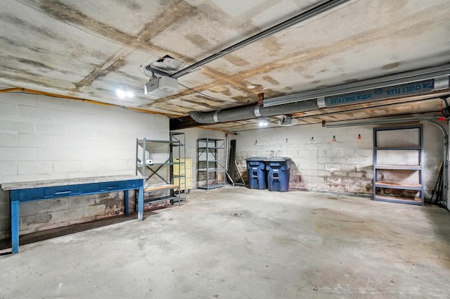 1244 N Broad St, Lancaster, OH 43130 - garage featuring a garage door opener and concrete block wall