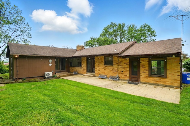 1244 N Broad St, Lancaster, OH 43130 - back of property with a chimney, a lawn, ac unit, and a patio