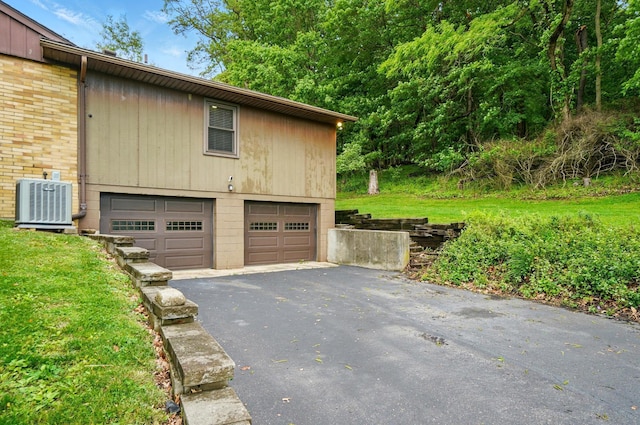 1244 N Broad St, Lancaster, OH 43130 - garage with cooling unit and asphalt driveway