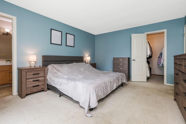 1790 Jupiter Ave, Hilliard, OH 43026 - bedroom with light colored carpet, a spacious closet, a closet, connected bathroom, and baseboards