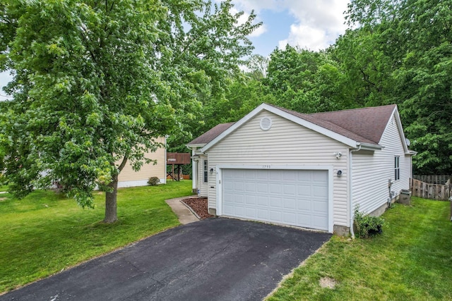 1790 Jupiter Ave, Hilliard, OH 43026 - view of front of home featuring driveway, a garage, a front lawn, and roof with shingles