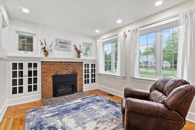 261 E Sandusky St, Mechanicsburg, OH 43044 - living room with baseboards, a brick fireplace, and recessed lighting