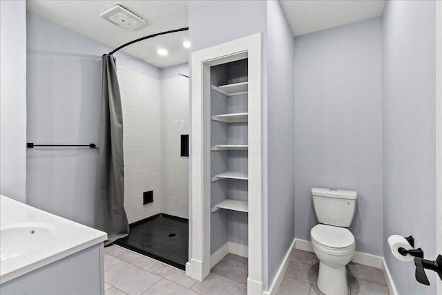 261 E Sandusky St, Mechanicsburg, OH 43044 - full bathroom with a shower stall, toilet, tile patterned flooring, baseboards, and vanity