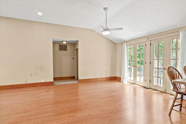 261 E Sandusky St, Mechanicsburg, OH 43044 - unfurnished living room featuring light wood-type flooring, ceiling fan, vaulted ceiling, and baseboards