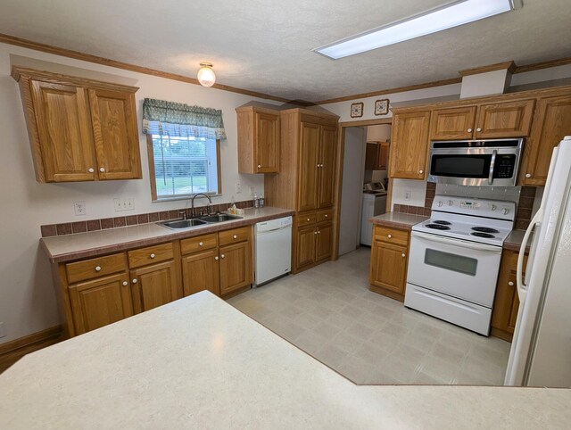 284 Camp Creek Rd, Lucasville, OH 45648 - kitchen featuring white appliances, a sink, brown cabinets, ornamental molding, and a textured ceiling