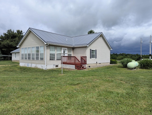 284 Camp Creek Rd, Lucasville, OH 45648 - back of property with crawl space, a yard, metal roof, and a deck