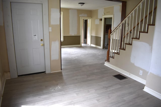 54 2nd St, Shelby, OH 44875 - entryway featuring stairway, wood finished floors, and baseboards