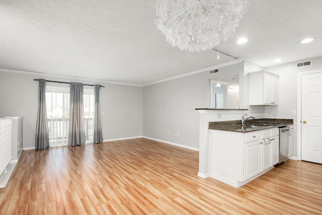 5373 Cypress Chase, Columbus, OH 43228 - kitchen with stainless steel dishwasher, a textured ceiling, ornamental molding, baseboards, and light wood-style flooring